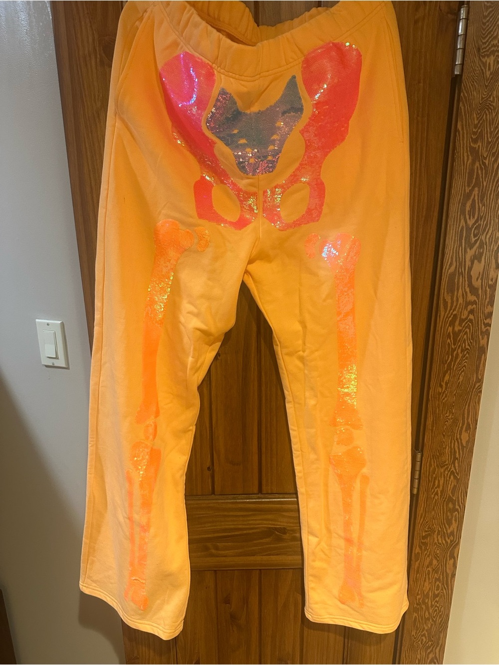 QUEEN OF SPARKLES Neon Orange skeleton Sweatpants NWT